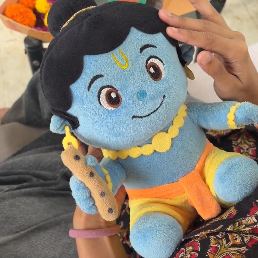 Customer holding the Krishna plush